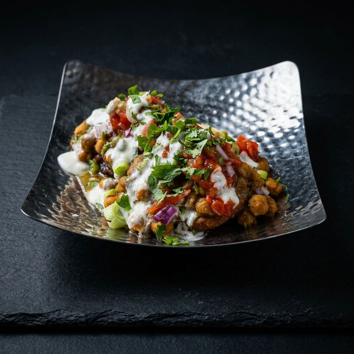 Aloo tikki chat topped with chutneys and yogurt at Taj Indian Cuisine & Bar in Madison, Wisconsin