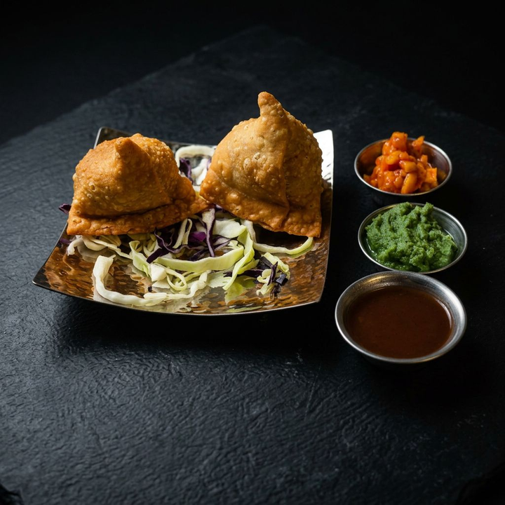 Vegetable samosas with chutneys at Taj Indian Cuisine & Bar in Madison, Wisconsin