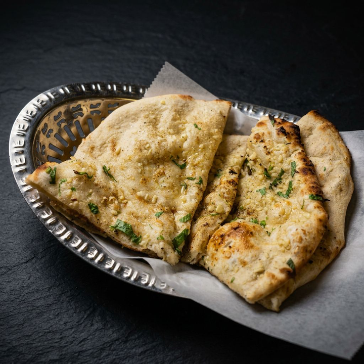 Garlic naan fresh from the tandoor at Taj Indian Cuisine & Bar in Madison, Wisconsin